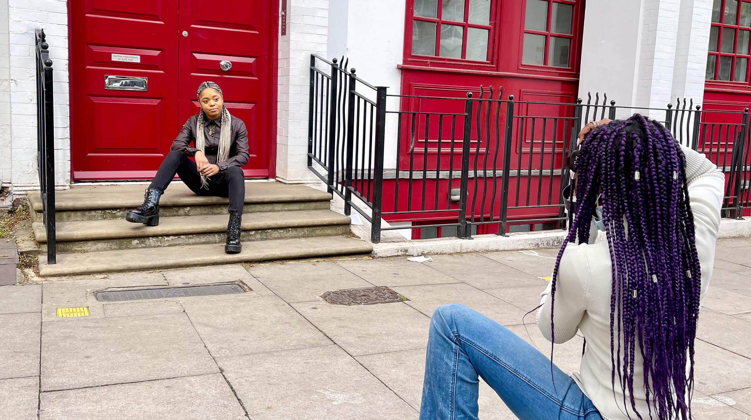 Lara Soluade taking a photograph of Lauren Marie Haywood